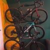 3 bikes hung one above the other with the Flowter Pedal Hanger